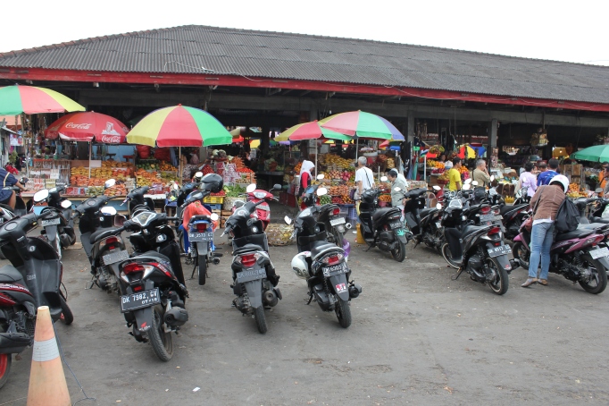 Scooters at a town market