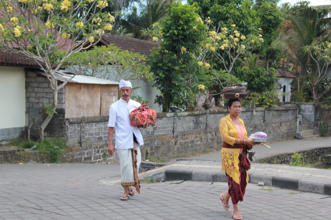 Villagers carrying offerings to the local temple